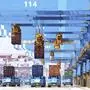 Gantry cranes move containers onto transporters at a port in Qingdao in eastern China's Shandong province Friday, June 4, 2021. China's exports surged nearly 28% in May while imports jumped 51% as demand rebounded in the U.S. and other markets where the pandemic is waning, though growth is leveling off after a stunning recovery from last year's slump. (Chinatopix via AP)