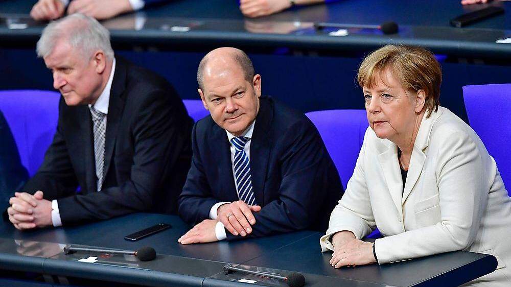 Seehofer, Scholz und Merkel