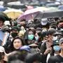 People take part in a pro-democracy march in the Kowloon district in Hong Kong on October 20, 2019. - Large crowds of Hong Kongers defied a police ban and began an illegal march on October 20, their numbers swollen by anger over the recent stabbing and beating of two pro-democracy protesters. (Photo by Anthony WALLACE / AFP)