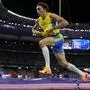 Armand Duplantis, of Sweden, celebrates after setting a new world record in the men's pole vault final at the 2024 Summer Olympics, Monday, Aug. 5, 2024, in Saint-Denis, France. (AP Photo/Bernat Armangue)