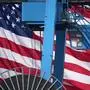 A crane operator loads a container onto a ship at the Gloucester Marine Terminal Wednesday, Oct. 15, 2025, in Gloucester City, N.J. (AP Photo/Matt Slocum)