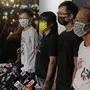FILE - In this Sunday, Sept. 5, 2021, file photo, Chow Hang-tung, second from left, vice chairwoman of the Hong Kong Alliance in Support of Patriotic Democratic Movements of China, and other group members attend a news conference in Hong Kong. Four leaders of the Hong Kong activist group, including Chow, have been arrested after defying a police request to cooperate in a national security investigation, the group said Wednesday, Sept. 8, 2021.  (AP Photo/Kin Cheung, File)