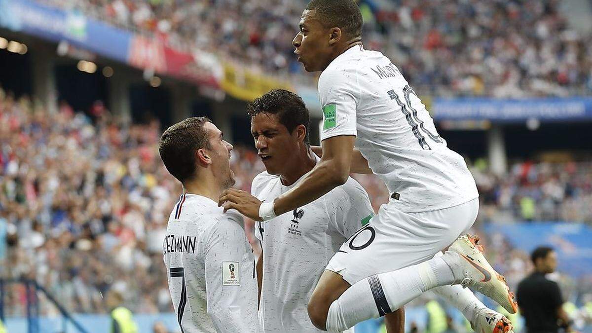 Raphael Varane, Kylian Mbappe, Antoine Griezmann