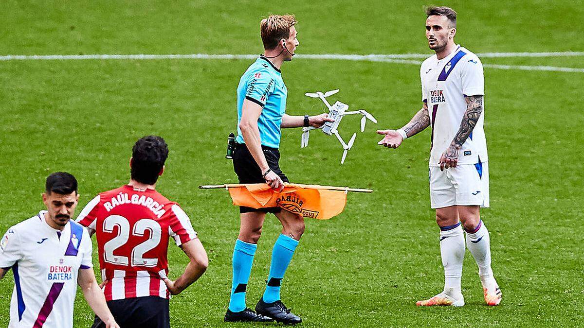 March 20, 2021, BILBAO, VIZCAYA, SPAIN: The referee Pizarro Gomez catches a drone during the Spanish league, La Liga San