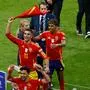 Spain's forward #22 Jesus Navas. Spain's forward #11 Ferran Torres and Spain's forward #19 Lamine Yamal celebrate after winning the UEFA Euro 2024 final football match between Spain and England at the Olympiastadion in Berlin on July 14, 2024. (Photo by Odd ANDERSEN / AFP)