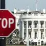 A stop sign is seen near the White House during a government shutdown in Washington, DC, December 27, 2018. - Congress members trickled back into Washington but there was little hope of ending the government shutdown sparked by a row with President Donald Trump over his demand for US-Mexico border wall construction. A lapse in funding to parts of the government meanwhile entered a sixth day. (Photo by Andrew CABALLERO-REYNOLDS / AFP)