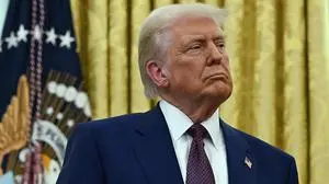 US President Donald Trump listens as the new US Secretary of Health and Human Services Robert F. Kennedy Jr., speaks after being sworn in at the Oval Office of the White House in Washington, DC, on February 13, 2025. (Photo by ANDREW CABALLERO-REYNOLDS / AFP)