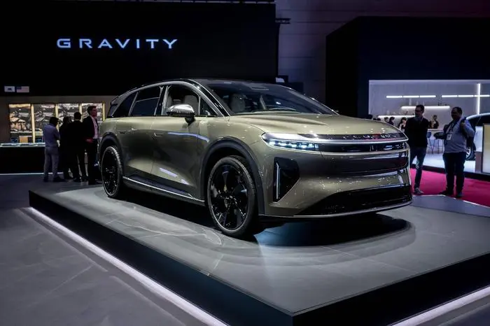 A Lucid Gravity model car is seen at the stand of the US carmaker at the Geneva International Motor Show in Geneva, on February 26, 2024. (Photo by Fabrice COFFRINI / AFP)