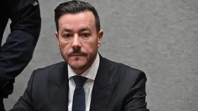 Fallen Austrian property tycoon Rene Benko is pictured in the courtroom during his trial over alleged fraud, the first charges in a wide-ranging investigation into the insolvency of his former real estate empire, on October 15, 2025 at the Regional court of Innsbruck, Austria. Benko, once one of Austria's richest men, founded the Signa Holding in 2000, but the debt-laden group crumbled in 2023 in the largest insolvency proceedings in the country's history. (Photo by KERSTIN JOENSSON / AFP)