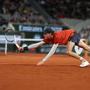 Italy's Jannik Sinner plays a backhand return to Russia's Pavel Kotov during their men's singles match on Court Philippe-Chatrier on day six of the French Open tennis tournament at the Roland Garros Complex in Paris on May 31, 2024. (Photo by Alain JOCARD / AFP)