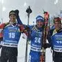 (L-R) Austria's Julian Eberhard (3rd), Italy's Dominik Windisch (1st) and France's Antonin Guigonnat (2nd) celebrate after the men's 15 km mass start event at the IBU World Biathlon Championships in Oestersund, Sweden, on March 17, 2019. (Photo by Jonathan NACKSTRAND / AFP)