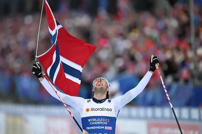 Norway's Jarl Magnus Riiber celebrates after winning the men's 50km Mass Start Free event of the Cross Country discipline at the FIS Nordic World Ski Championships in Trondheim, Norway on March 8, 2025.  (Photo by Jonathan NACKSTRAND / AFP)