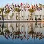 TOPSHOT - People gather at the Flag plaza in Doha on November 15, 2022, ahead of the Qatar 2022 World Cup football tournament. (Photo by ANDREJ ISAKOVIC / AFP)