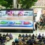 Attendees watch a presentation during the annual Apple "Worldwide Developers Conference" (WWDC) at Apple Park, the corporate headquarters of Apple Inc., in Cupertino, California on June 9, 2025. (Photo by Josh Edelson / AFP)