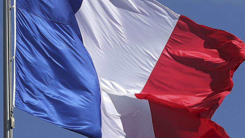 Stolz präsentieren die Franzosen am heutigen Nationalfeiertag ihre Flagge 