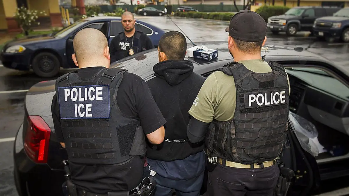 FILE - In this Tuesday, Feb. 7, 2017, photo released by U.S. Immigration and Customs Enforcement, foreign nationals are arrested during a targeted enforcement operation conducted by U.S. Immigration and Customs Enforcement (ICE) aimed at immigration fugitives, re-entrants and at-large criminal aliens in Los Angeles. A federal appeals court has given the Trump administration a rare legal win in its efforts to crack down on sanctuary cities. In a 2-1 decision Friday, July 12, 2019, the 9th U.S. Circuit Court of Appeals said the Justice Department was within its rights to give priority status for multimillion-dollar community policing grants to departments that agree to cooperate with immigration officials. (Charles Reed/U.S. Immigration and Customs Enforcement via AP, File)
