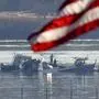 An American Flag flies above a search and rescue operation underway as dozens are feared dead after American Eagle regional jet and Army helicopter collide and crash into Potomac River on Thursday, January 30, 2025 in Washington DC. More than 30 bodies have been recovered from the Potomac River where American Eagle Flight 5342 and a military helicopters both lie in ruin. So far there are no survivors. PUBLICATIONxINxGERxSUIxAUTxHUNxONLY WAP2025013090402 KenxCedeno