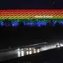 (FILES) In this file photo taken on January 30, 2021 traffic passes the Allianz Arena illuminated in the rainbow colours after the German first division Bundesliga football match FC Bayern Munich v TSG 1899 Hoffenheim in Munich, southern Germany. - UEFA on June 22, 2021 rejected plans by the city of Munich to light the Allianz Arena in rainbow colours for the Germany-Hungary Euro 2020 match to protest at a law passed by the Hungarian government. "UEFA is a politically and religiously neutral organisation," said European football's governing body in a statement. (Photo by Andreas GEBERT / POOL / AFP)