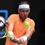 (FILES) Spain's Rafael Nadal hits a return against Britain's Jack Draper during their men's singles match on day one of the Australian Open tennis tournament in Melbourne on January 16, 2023. Spanish superstar Nadal on January 7, 2024 pulled out of the Australian Open with a "micro tear on a muscle", barely a week after making his comeback from a year-long injury absence. (Photo by WILLIAM WEST / AFP) / -- IMAGE RESTRICTED TO EDITORIAL USE - STRICTLY NO COMMERCIAL USE --