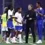 France’s head coach Laurent Bonadei (2R) gives instructions to his players during the women's friendly football match between France and Brazil at the Stade des Alpes in Grenoble, central-eastern France, on June 27, 2025. (Photo by Alex MARTIN / AFP)
