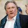 (FILES) French actor Gerard Depardieu waves as he arrives at the Town Hall in Brussels for a ceremony as part of the 'Brussels International Film Festival' (Briff) on June 25, 2018. French police summoned Depardieu over suspected sexual assault, a police source said on April 29, 2024. Depardieu already faces a rape charge and sexual assault investigation, as well as claims of assault by more than a dozen women -- all of which he has strongly denied. (Photo by THIERRY ROGE / BELGA / AFP) / Belgium OUT