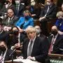 A handout photograph released by the UK Parliament shows Britain's Prime Minister Boris Johnson attending Prime Minister's Questions (PMQs) in the House of Commons in London on January 12, 2022. - UK Prime Minister Boris Johnson Wednesday apologised for attending a lockdown-breaching party held in his Downing Street garden, but deflected calls to resign as the opposition leader called him a "man without shame". After days of dismal headlines and collapsing poll ratings, Johnson said he regarded the newly revealed boozy get-together in May 2020 as a work event for Downing Street staff. (Photo by JESSICA TAYLOR / various sources / AFP) / RESTRICTED TO EDITORIAL USE - NO USE FOR ENTERTAINMENT, SATIRICAL, ADVERTISING PURPOSES - MANDATORY CREDIT " AFP PHOTO / Jessica Taylor /UK Parliament"
