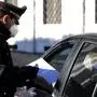 Carabinieri police officers check documents at a road block in Rome, Monday, March 15, 2021. Half of Italy’s regions have gone into the strictest form of lockdown in a bid to curb the latest spike in coronavirus infections that have brought COVID-19 hospital admissions beyond manageable thresholds. (Cecilia Fabiano/LaPresse via AP)