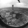 In this 1986 photo, a chimney and the sarcophagus under construction over the 4th destroyed reactor at the Chernobyl nuclear power plant is seen through a helicopter window. On May 12, 1986, more than two weeks after the explosion, the leading Soviet daily newspaper Pravda published its first photograph from the site for the first time, shot three days earlier from a helicopter by Repik. "If I had been ordered now to get aboard and go, I would not have gone _ you might have easily died there for nothing," said the 65-year-old Repik.(Foto:Volodymyr Repik/AP/dapd)