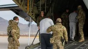 This handout picture courtesy of the US Army shows US Transportation Command supports Immigration and Customs Enforcement deportation flights by providing military airlift, Fort Bliss, Texas, on February 10, 2025. Trump administration has begun using military aircraft to underscore its determination to deport undocumented migrants. But while the optics make for good political theatre, the flights are expensive -- as much as $1 million in the case of a recent deportation to India, according to an AFP analysis. (Photo by Sgt. Griffin Payne / US ARMY / AFP) / RESTRICTED TO EDITORIAL USE - MANDATORY CREDIT "AFP PHOTO / US ARMY" - NO MARKETING NO ADVERTISING CAMPAIGNS - DISTRIBUTED AS A SERVICE TO CLIENTS