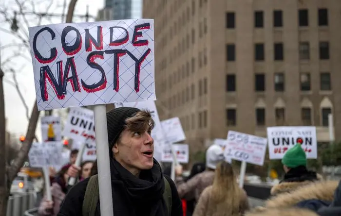 Unionized staff at Condé Nast walk the picket line during a 24-hour walk out amid layoff announcements, in front of the Condé Nast offices at One World Trade Center New York City on January 23, 2024. The strike comes after Condé Nast said it would lay off approximately 5% of its staff, some 300 employees. (Photo by ANGELA WEISS / AFP)