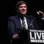 Tucker Carlson speaks before talking with Republican presidential nominee former President Donald Trump at a Tucker Carlson Live Tour show at Desert Diamond Arena, Thursday, Oct. 31, 2024, in Glendale, Ariz. (AP Photo/Julia Demaree Nikhinson)