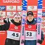 Second-placed Norway's Marius Lindvik (L) poses with third-placed Norway's Johann Andre Forfang (R) at the podium at the end of the second day of the men's FIS Ski Jumping World Cup competition in Sapporo on February 16, 2025. (Photo by Richard A. Brooks / AFP)