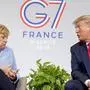 U.S. President Donald Trump and German Chancellor Angela Merkel speak during a bilateral meeting at the G-7 summit in Biarritz, France, Monday, Aug. 26, 2019. (AP Photo/Andrew Harnik)