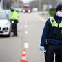 Police personnel man a control post on the border between Belgium and Netherlands on the N762 highway at Molenbeersel on March 20, 2020, as attempts are made to stop the spread of COVID-19 (novel coronavirus). (Photo by YORICK JANSENS / BELGA / AFP) / Belgium OUT