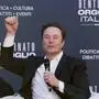 Tesla and SpaceX's CEO Elon Musk cheers as he speaks at the annual political festival Atreju, organized by the Giorgia Meloni's Brothers of Italy political party, in Rome, Saturday, Dec. 16, 2023. (AP Photo/Alessandra Tarantino)