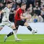 FC Copenhagen's Kevin Diks, left, and Manchester United's Rasmus Hojlund, right, challenge for the ball during the Champions League Group A soccer match between FC Copenhagen and Manchester United in Copenhagen, Denmark, Wednesday, Nov. 8, 2023. (Liselotte Sabroe/Ritzau Scanpix via AP)