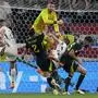 Scotland's goalkeeper Angus Gunn, up, collides with Hungary's Barnabas Varga, right, during a Group A match between Scotland and Hungary at the Euro 2024 soccer tournament in Stuttgart, Germany, Sunday, June 23, 2024. (AP Photo/Matthias Schrader)