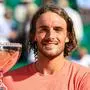 Greece's Stefanos Tsitsipas celebrates with the trophy after winning at the end of his Monte Carlo ATP Masters Series Tournament final tennis match against Norway's Casper Ruud on the Rainier III court at the Monte Carlo Country Club on April 14, 2024. (Photo by Valery HACHE / AFP)