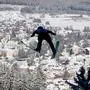 Germany's Katharina Althaus soars through the air during the women's Large Hill Individual qualification of the FIS Ski Jumping World Cup in Titisee-Neustadt, southwestern Germany on December 11, 2022. (Photo by THOMAS KIENZLE / AFP)