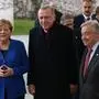 A handout picture taken and released on January 19 , 2020 in Berlin by the Turkish Presidential Press service shows German Chancellor Angela Merkel (L) , United Nations Secretary-General, Antonio Guterres (R) and Turkish President Recep Tayyip Erdogan (C) posing as they arrive for an international summit on securing peace in Libya  at the Chancellery in Berlin. (Photo by Murat KULA / TURKISH PRESIDENTIAL PRESS SERVICE / AFP) / RESTRICTED TO EDITORIAL USE - MANDATORY CREDIT "AFP PHOTO / Turkish Presidential Press / Murat KULA" - NO MARKETING - NO ADVERTISING CAMPAIGNS - DISTRIBUTED AS A SERVICE TO CLIENTS
