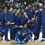 TOPSHOT - Gold medallists (From L) USA's #04 Stephen Curry, USA's #07 Kevin Durant, USA's #05 Anthony Edwards, USA's #09 Tyrese Haliburton, USA's #08 Derrick White, USA's #10 Jayson Tatum, USA's #06 LeBron James, USA's #11 Joel Embiid, USA's #13 Bam Adebayo, USA's #14 Anthony Davis, USA's #15 Devin Booker and USA's #12 Jrue Holiday pose on the podium after the men's Gold Medal basketball match between France and USA during the Paris 2024 Olympic Games at the Bercy  Arena in Paris on August 10, 2024. (Photo by Damien MEYER / AFP)