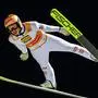 Austria's Stefan Kraft soars through the air during the first scoring round of the Men's Individual Large Hill HS140 event of the FIS Ski Jumping World Cup in Klingenthal, eastern Germany on December 10, 2023. (Photo by JENS SCHLUETER / AFP)
