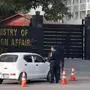 Police officers search a car at the main entry gate of Pakistan's Ministry of Foreign Affairs, in Islamabad, Pakistan, Thursday, Jan. 18, 2024. Pakistan's air force launched retaliatory airstrikes early Thursday on Iran allegedly targeting militant positions, an attack that killed at least several people and further raised tensions between the neighboring nations. (AP Photo/Anjum Naveed)