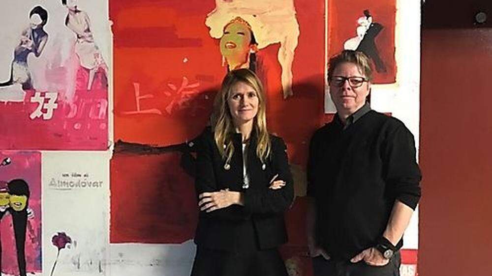 Angela Fabris und Jörg Helbig vor Filmpostern im Kino Visionario in Udine