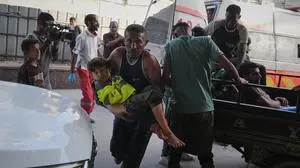 Wounded Palestinian child is brought to Nasser Hospital after an Israeli army bombardment in Khan Younis, Gaza Strip, Sunday, Oct. 19, 2025. (AP Photo/Jehad Alshrafi)