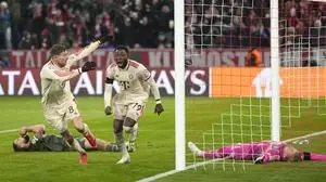 Bayern's Alphonso Davies, centre, celebrates after scoring his side's opening goal during the Champions League playoff second leg soccer match between FC Bayern Munich and Celtic Glasgow at the Allianz Arena in Munich, Germany, Tuesday, Feb. 18, 2025. (AP Photo/Matthias Schrader)