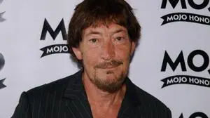 (FILES) British singer, songwriter Chris Rea arrives at the MOJO magazine music awards in central London on June 11, 2009. British singer Chris Rea, best known for the 1980s festive hit "Driving Home For Christmas", has died at the age of 74, a family spokesperson told UK media on December 22, 2025. (Photo by MAX NASH / AFP)