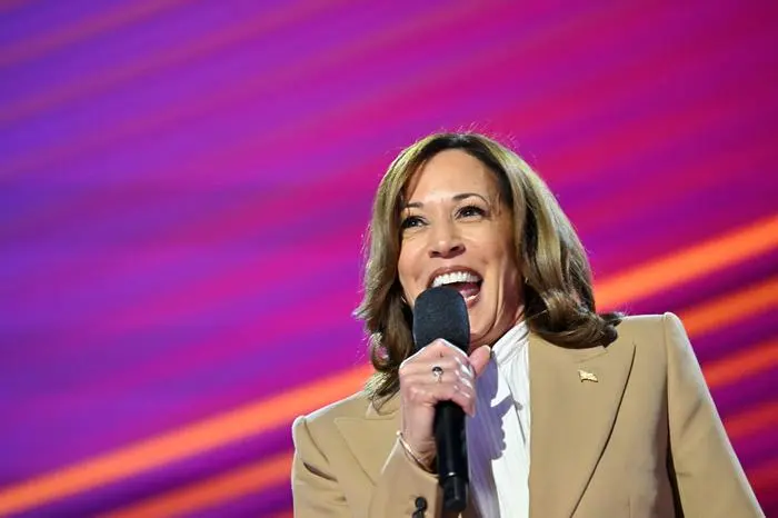 TOPSHOT - US Vice President and 2024 Democratic presidential candidate Kamala Harris speaks on the first day of the Democratic National Convention (DNC) at the United Center in Chicago, Illinois, on August 19, 2024. Vice President Kamala Harris will formally accept the party’s nomination for president at the DNC which runs from August 19-22 in Chicago. (Photo by Robyn Beck / AFP)