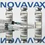 (FILES) In this file illustration photo taken on November 17, 2020 vials with Covid-19 Vaccine stickers attached and syringes with the logo of US biotech company Novavax, on November 17, 2020. - Novavax said February 10, 2022 its Covid vaccine was 82 percent effective among adolescents during the period when the Delta variant was dominant, and the US biotech now plans to submit for regulatory approval in this age group. (Photo by JUSTIN TALLIS / AFP)