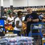 FILE - Shoppers pause in the produce section at a Walmart Superstore in Secaucus, New Jersey, July 11, 2024. (AP Photo/Eduardo Munoz Alvarez, File)